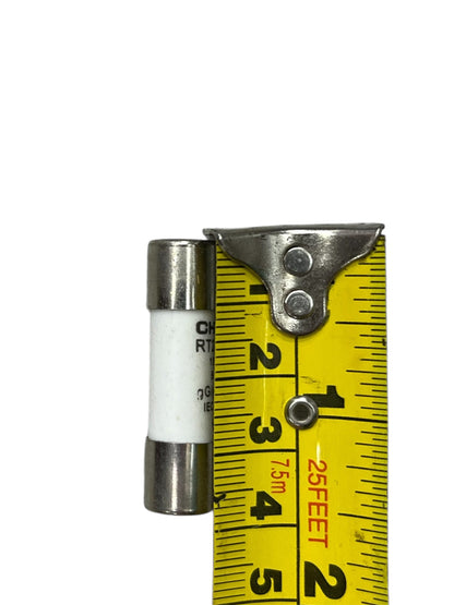Ceramic Fuse 6A 500V 10x38mm next to yellow measuring tape showing its size