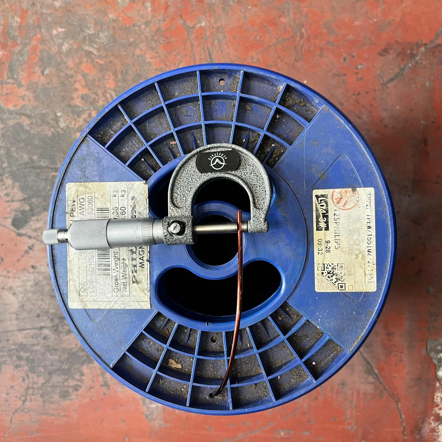 Philflex 700g copper coil wire AWG 10 on a blue spool, ideal for electrical projects and wiring applications