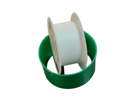 White roll of PTFE Teflon Tape on a green plastic holder for sealing pipe threads