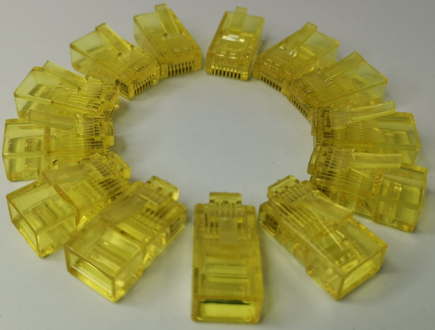 Denko RJ45 Connector colored yellow plastic network cable plugs arranged in a circle for Grippes powerline network adapter