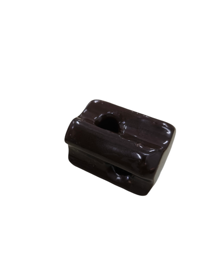 Local electrical ball insulator in dark brown for electrical circuitry and parts