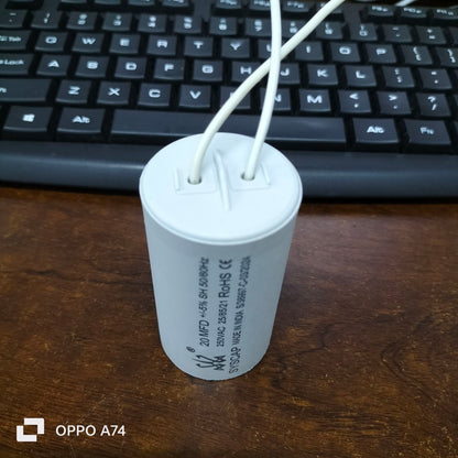 Syscap electrical capacitor for motors in white cylindrical shape with two wires