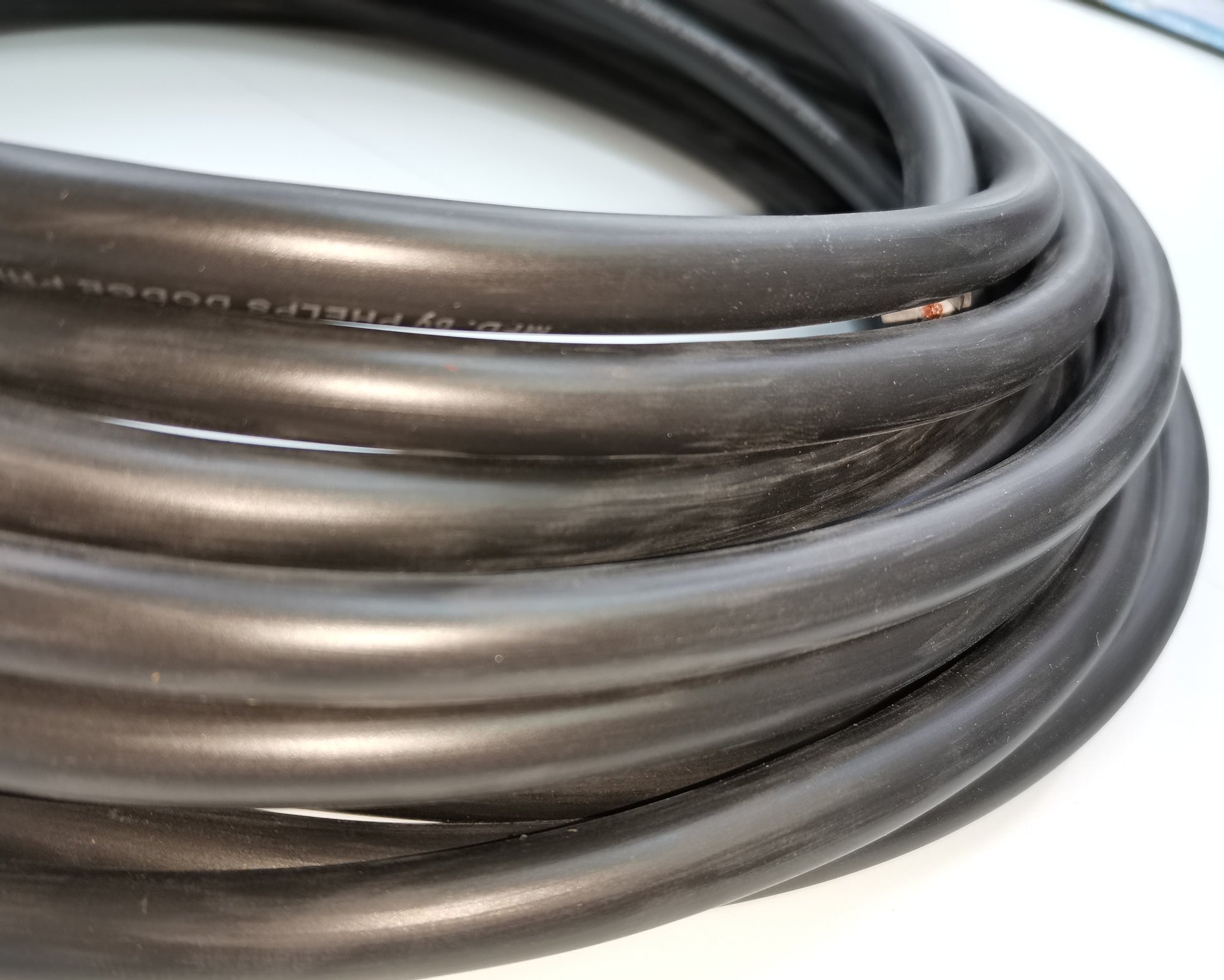 Phelps Dodge 18 gauge 2 core electrical wire coiled with black insulation for electrical projects
