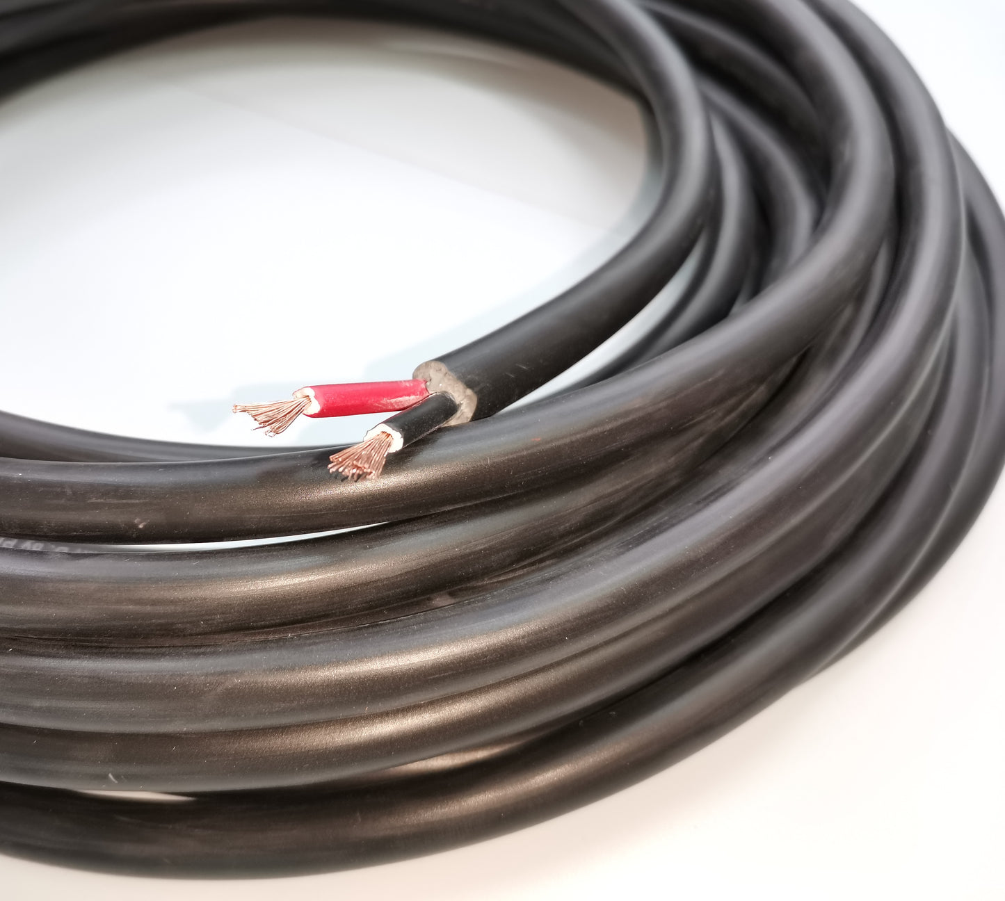 Phelps Dodge 18 gauge 2 core electrical wire with black insulation and exposed copper leads