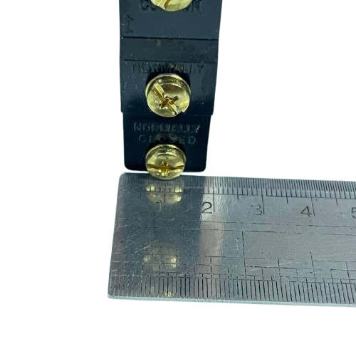 Tend Limit Switch 15A 250VAC TM1309 black housing with brass terminal screws and ruler for scale