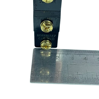 Tend Limit Switch 15A 250VAC TM1309 black housing with brass terminal screws and ruler for scale