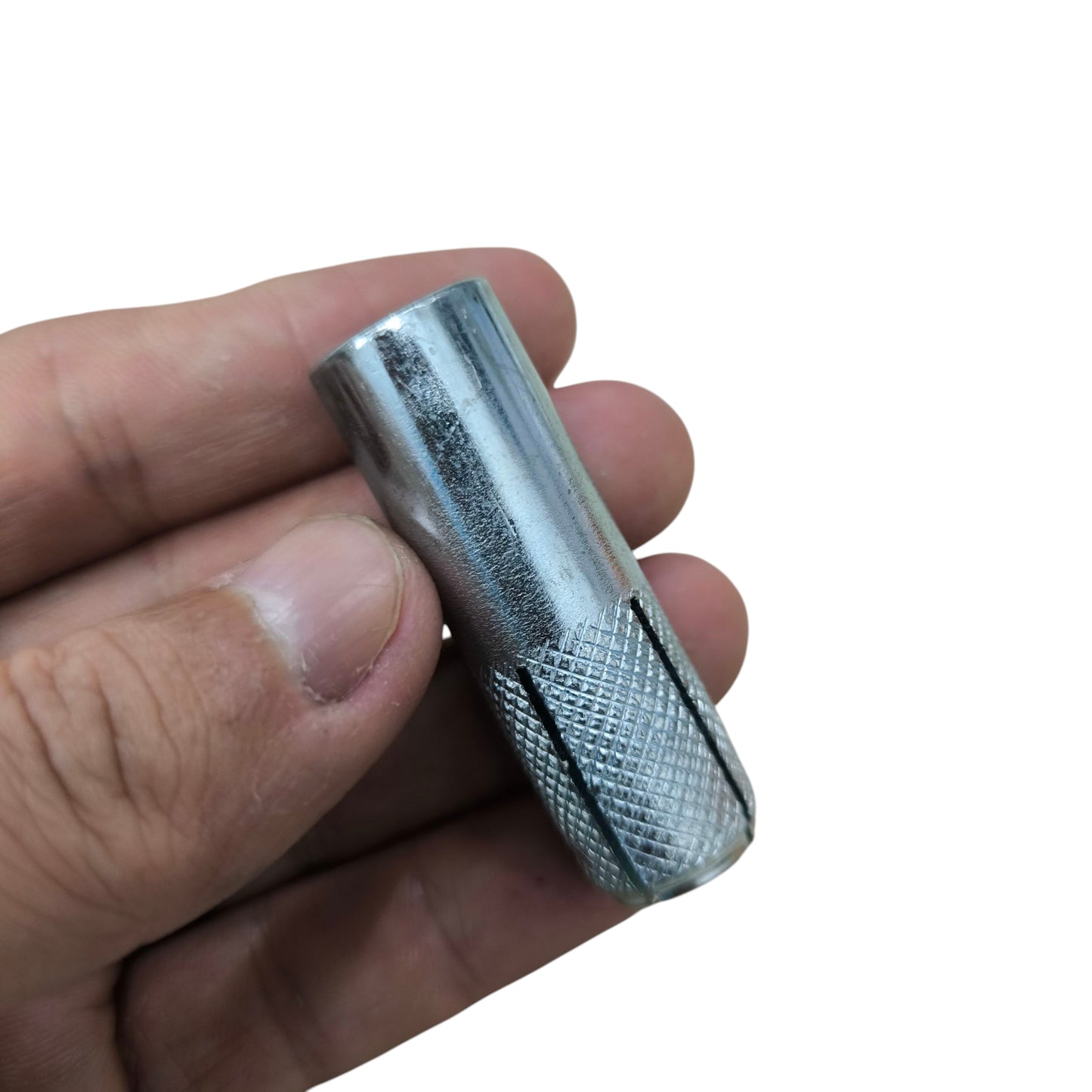 Hand holding a metal expansion anchor Bolt anchor grip sleeve with knurled end zinc plated for concrete anchors