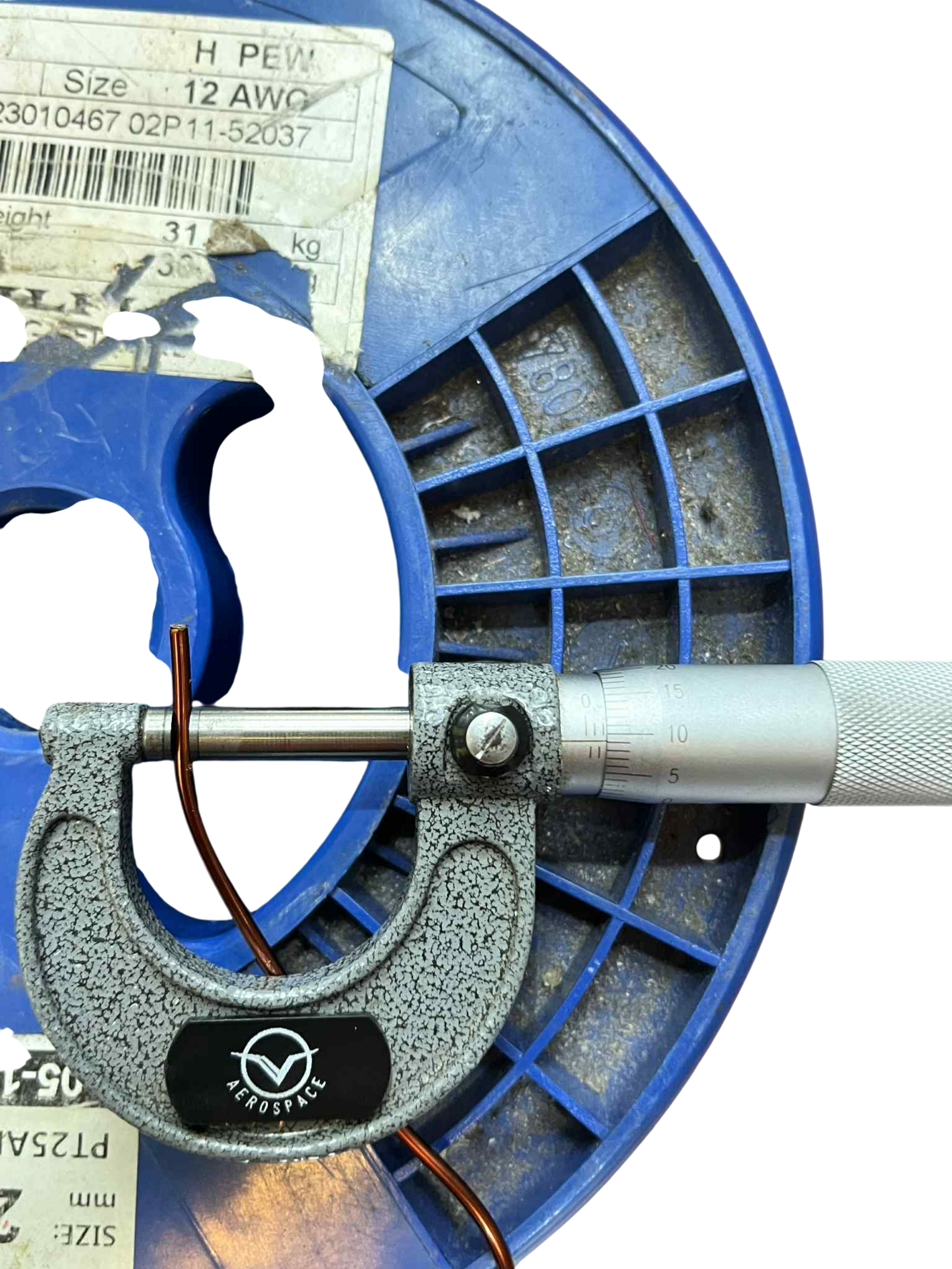 Philflex 2mm heavy formix magnet wire on a spool with a micrometer for precise measurement