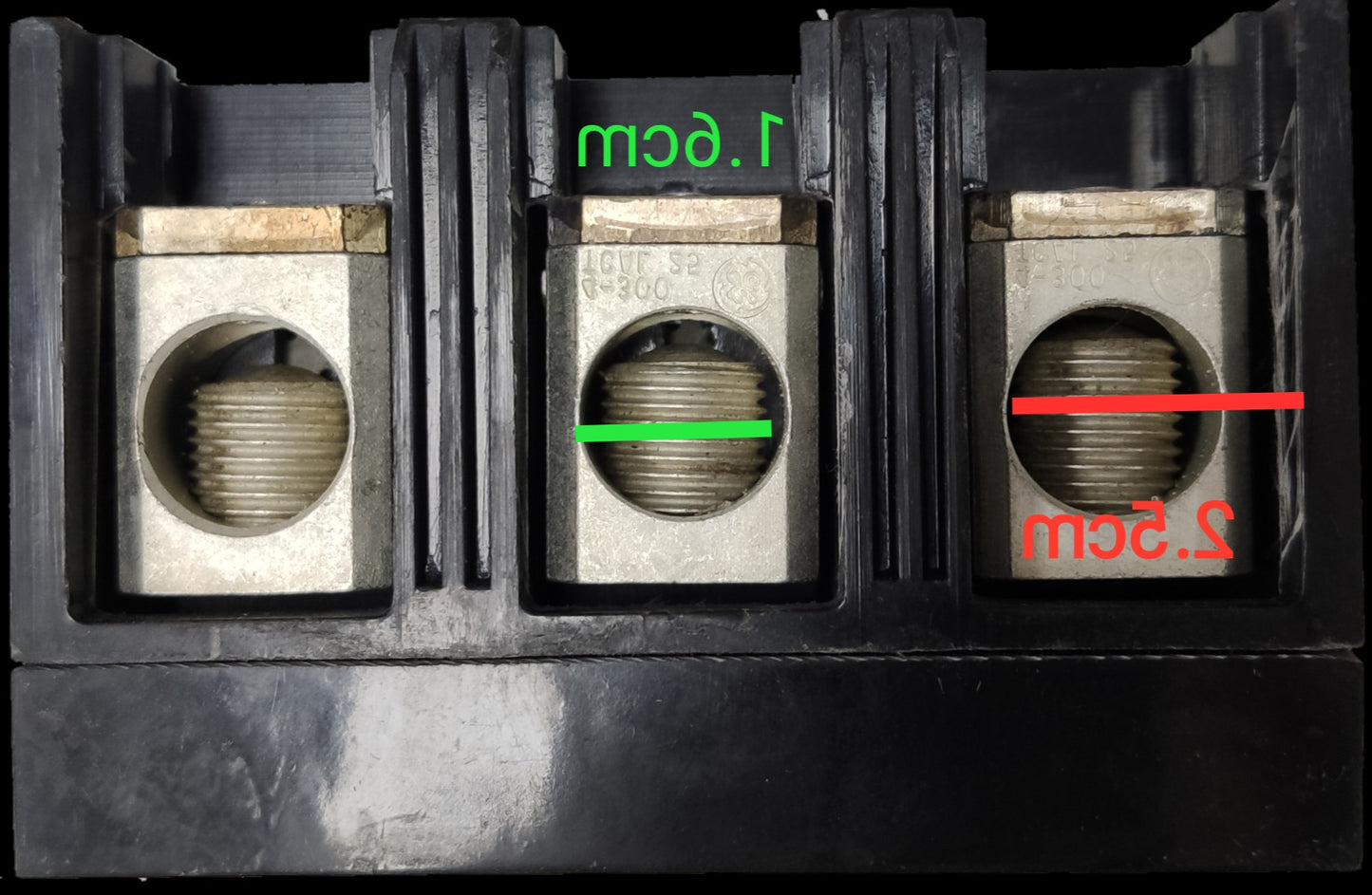 Close-up of GE 125A Circuit Breaker 3 Pole 220V showing metal terminals and measurements