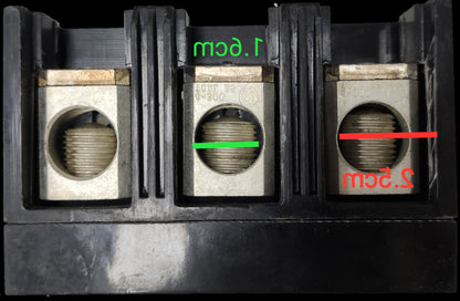 Close-up of GE 125A Circuit Breaker 3 Pole 220V showing metal terminals and measurements