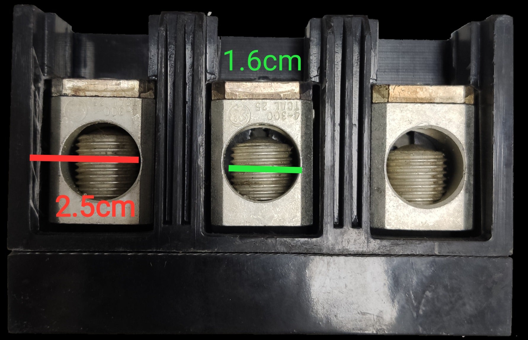 GE 175A 3 Phase 3 Pole Circuit Breaker with three metal connection points and black plastic housing