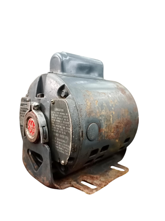 Rusty GE AC Motor electrical part with metal casing and mounting bracket