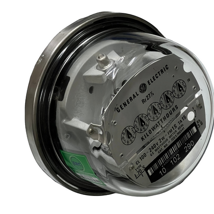 GE 2 Wire CL100 I70-S 4 Jaws Analog Meter round glass housing showing dials serial plate and terminals