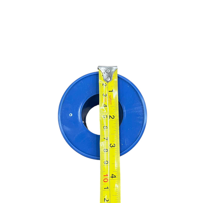 Top view blue 5 lbs plastic wire spool on white background with yellow measuring tape showing diameter