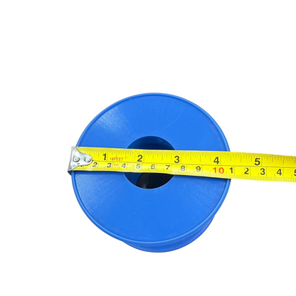 Blue 5 lbs plastic wire spool for handicraft projects top view with yellow measuring tape showing diameter