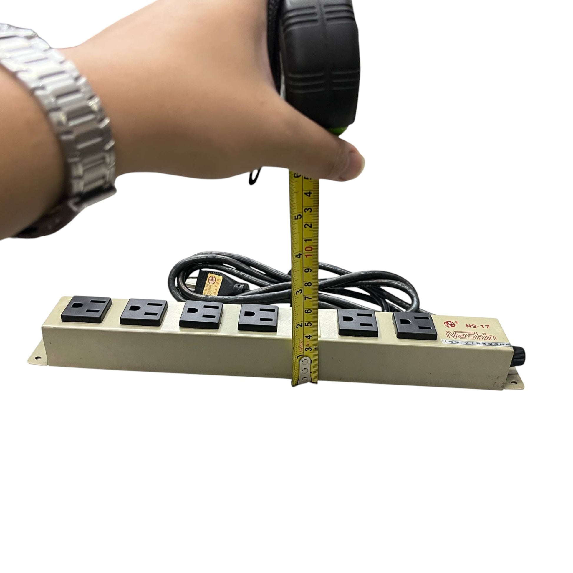 6 gang extension outlet with switch measuring height with tape and black power cord