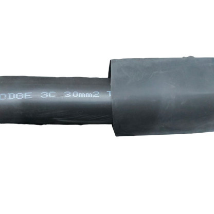 Black Heat Shrinkable Tube Black cable management tube partially covering a wire against a black background