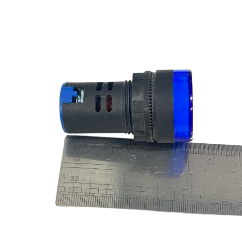 Denko Pilot Light 220v BLUE 22mm panel mount indicator next to ruler on black background showing size reference