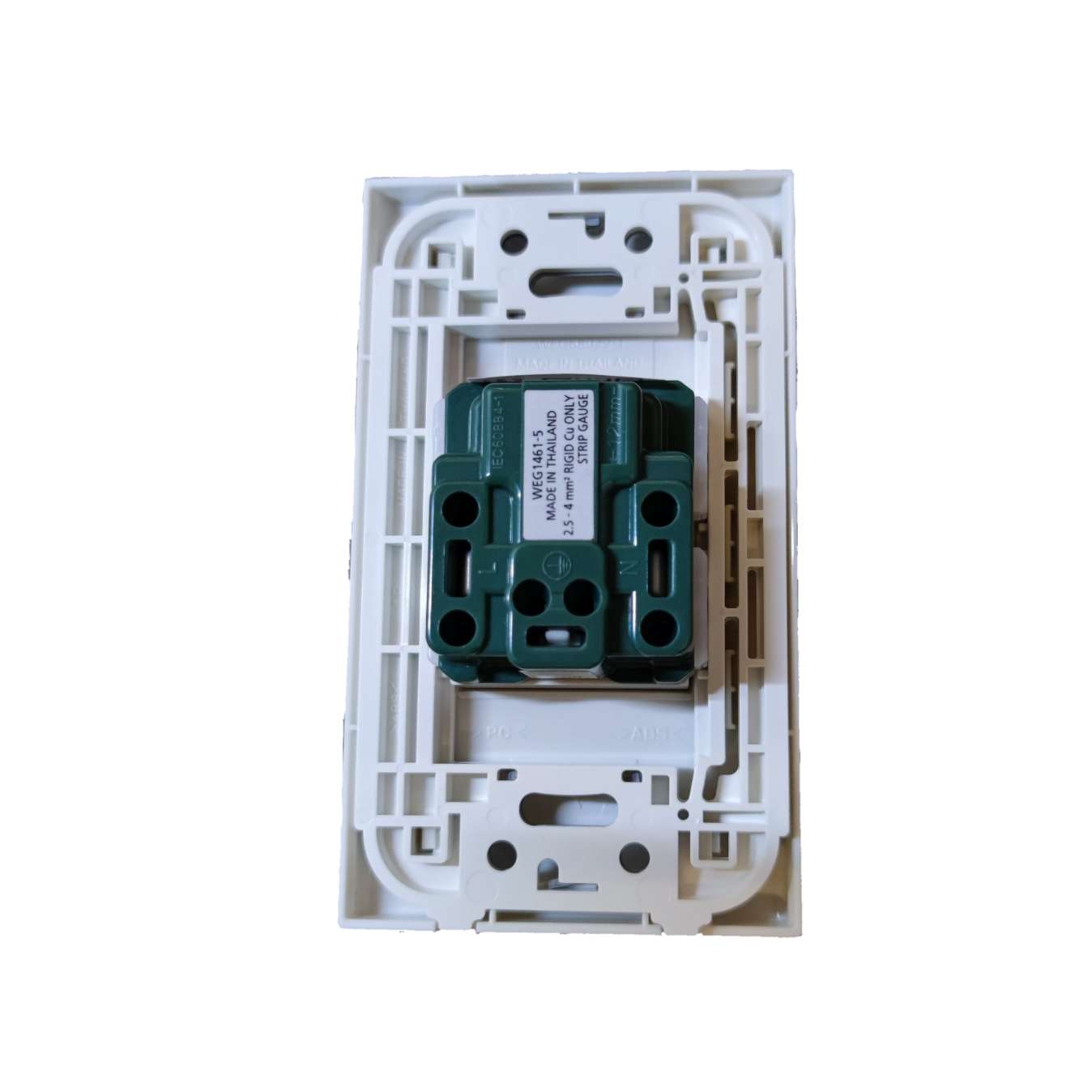 Panasonic Quick Connect Tandem Outlet 1 Gang 20A green outlet module installed in white wall plate frame