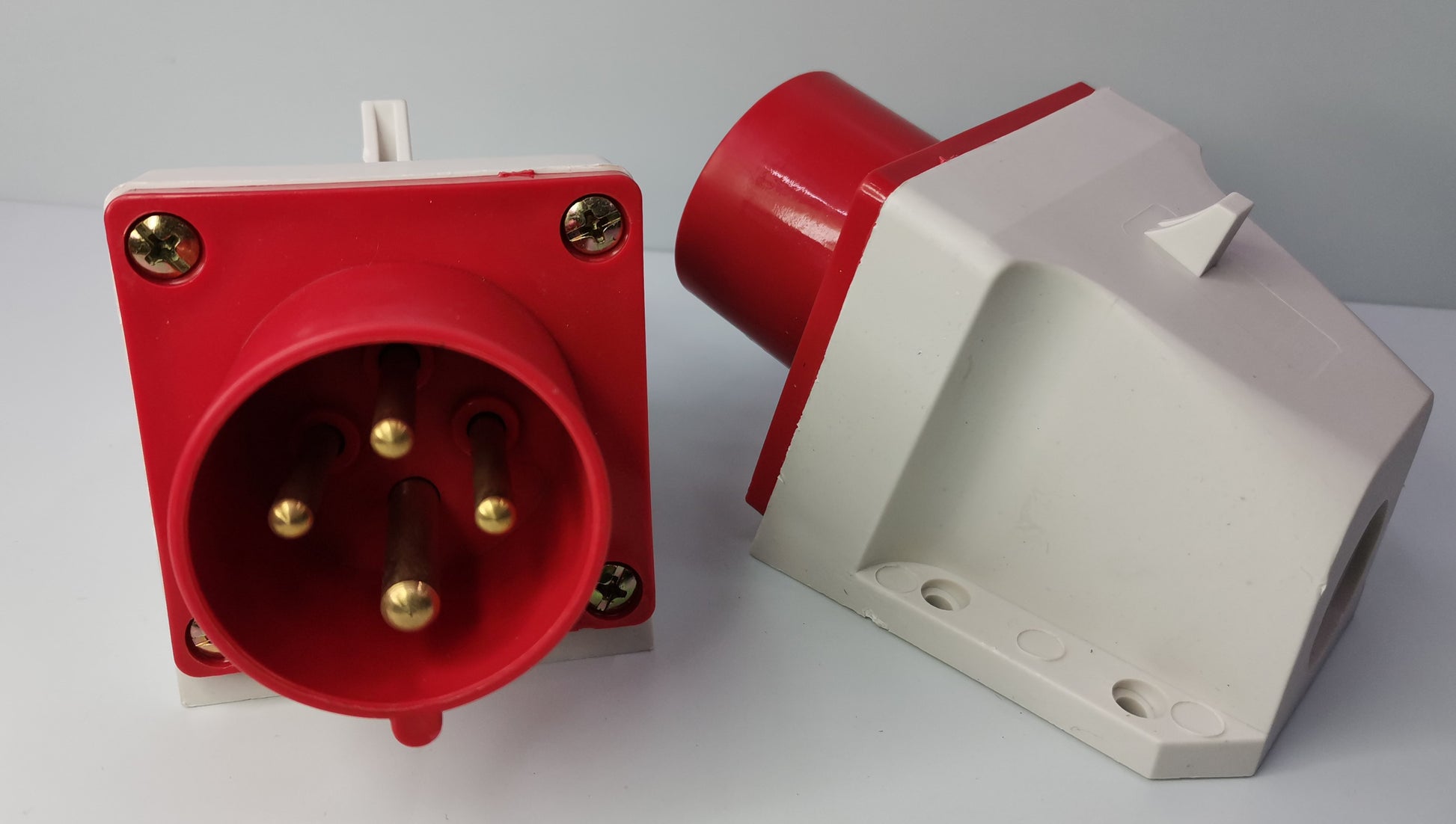 Grippes 16A industrial wall plug with red and white casing for electrical circuitry parts