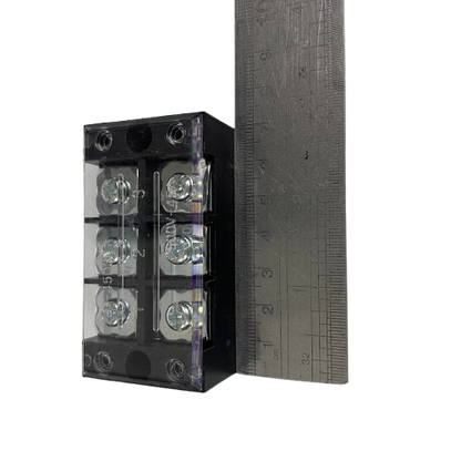 Grippes 45A 3 Pair Terminal Block 600V with clear plastic cover and three screw pairs beside ruler