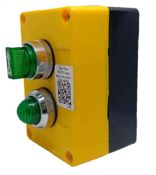 Auspicious green illuminated selector switch mounted on yellow and black industrial power control box