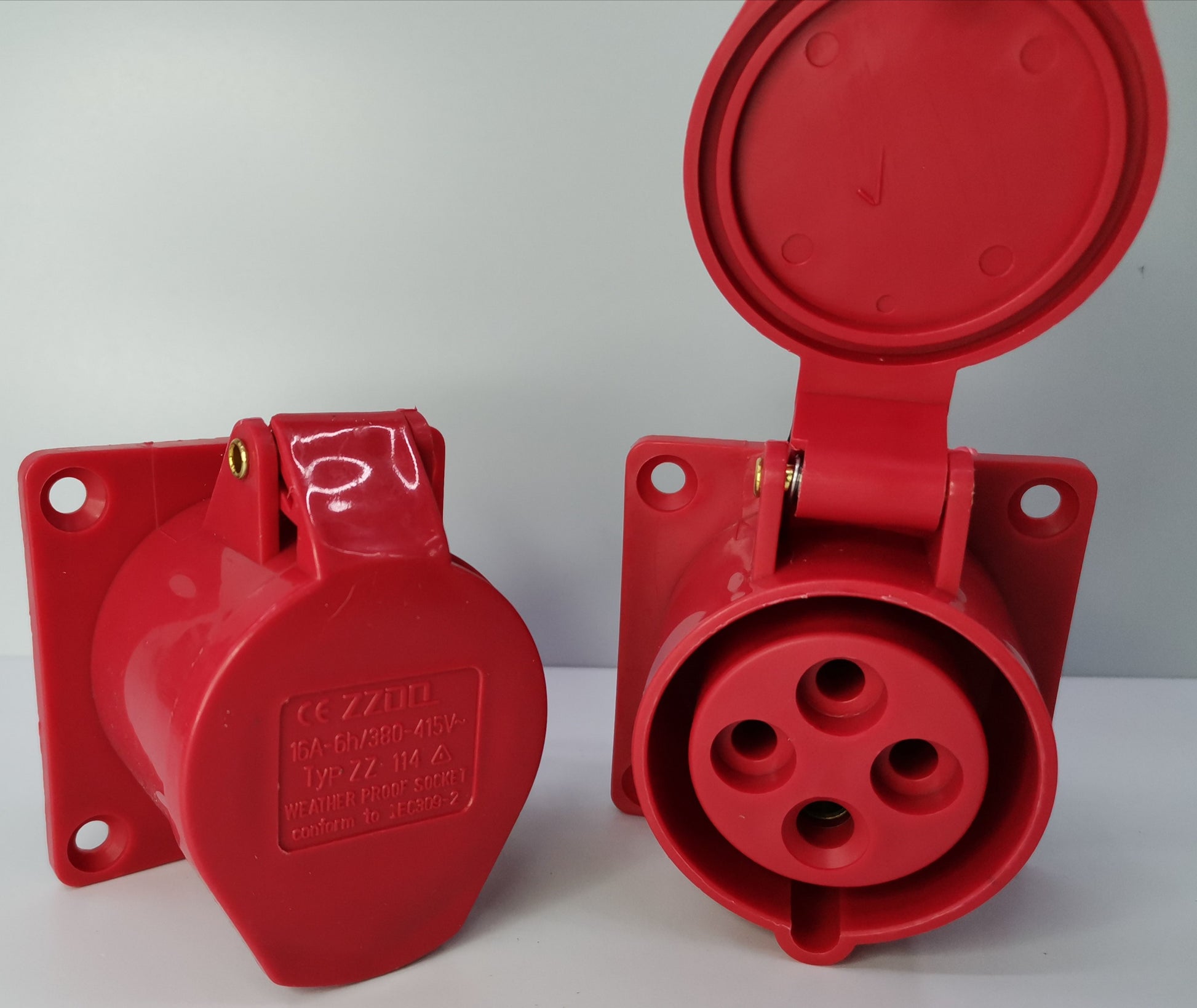 Grippes red industrial outlet chassis 16A with protective cover for secure electrical connections