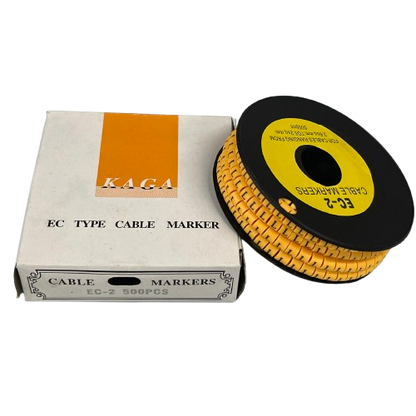 Cable Marker L - Yellow spool of EC type cable markers beside white KAGA box for wire labeling
