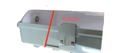 Close-up of Opple and Firefly 9W LED weatherproof fluorescent light with a measuring scale showing 9.4cm dimension