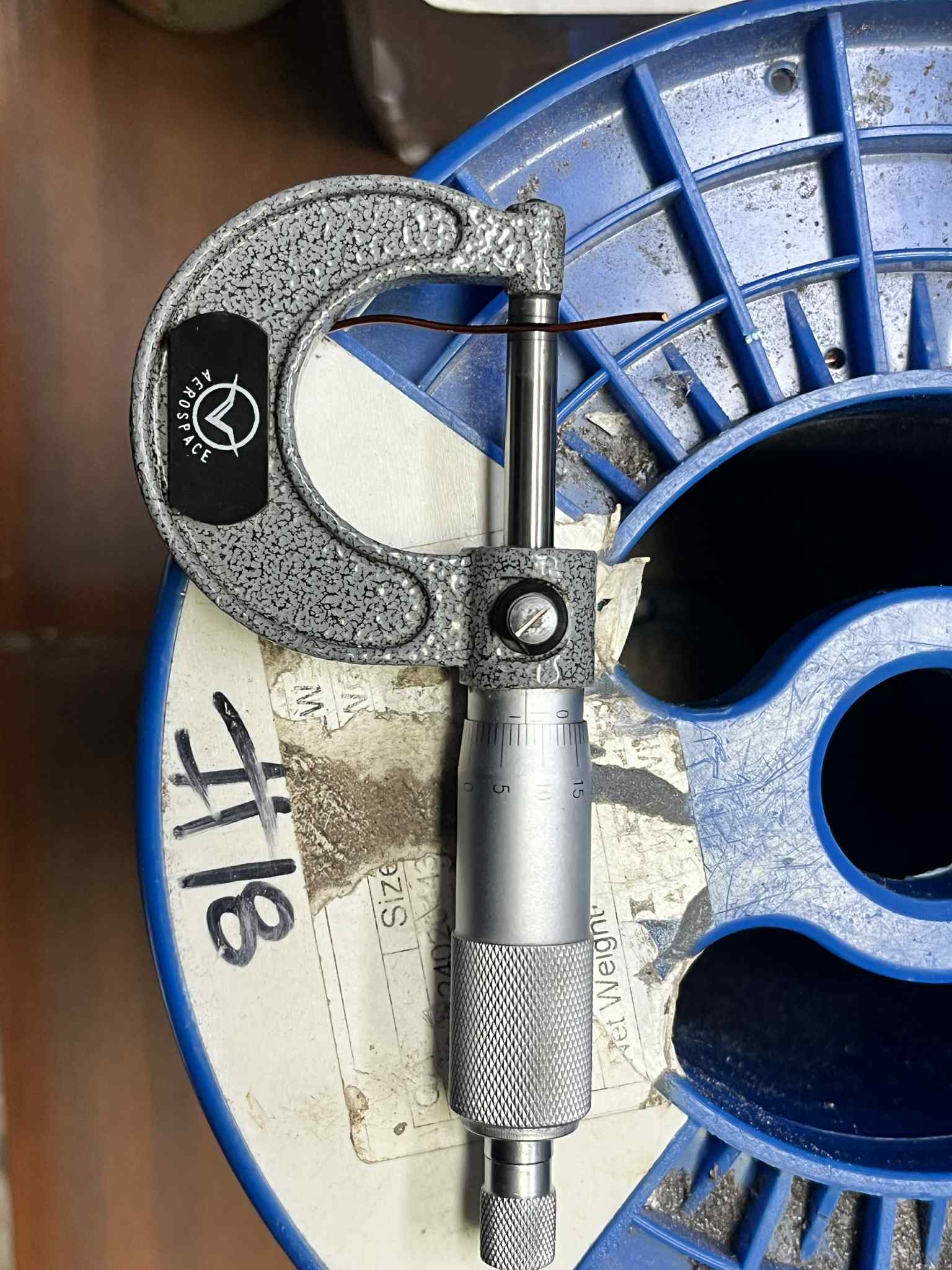 Philflex Magnet Wire AWG 18 100 Grams on a measuring device for precision wire applications