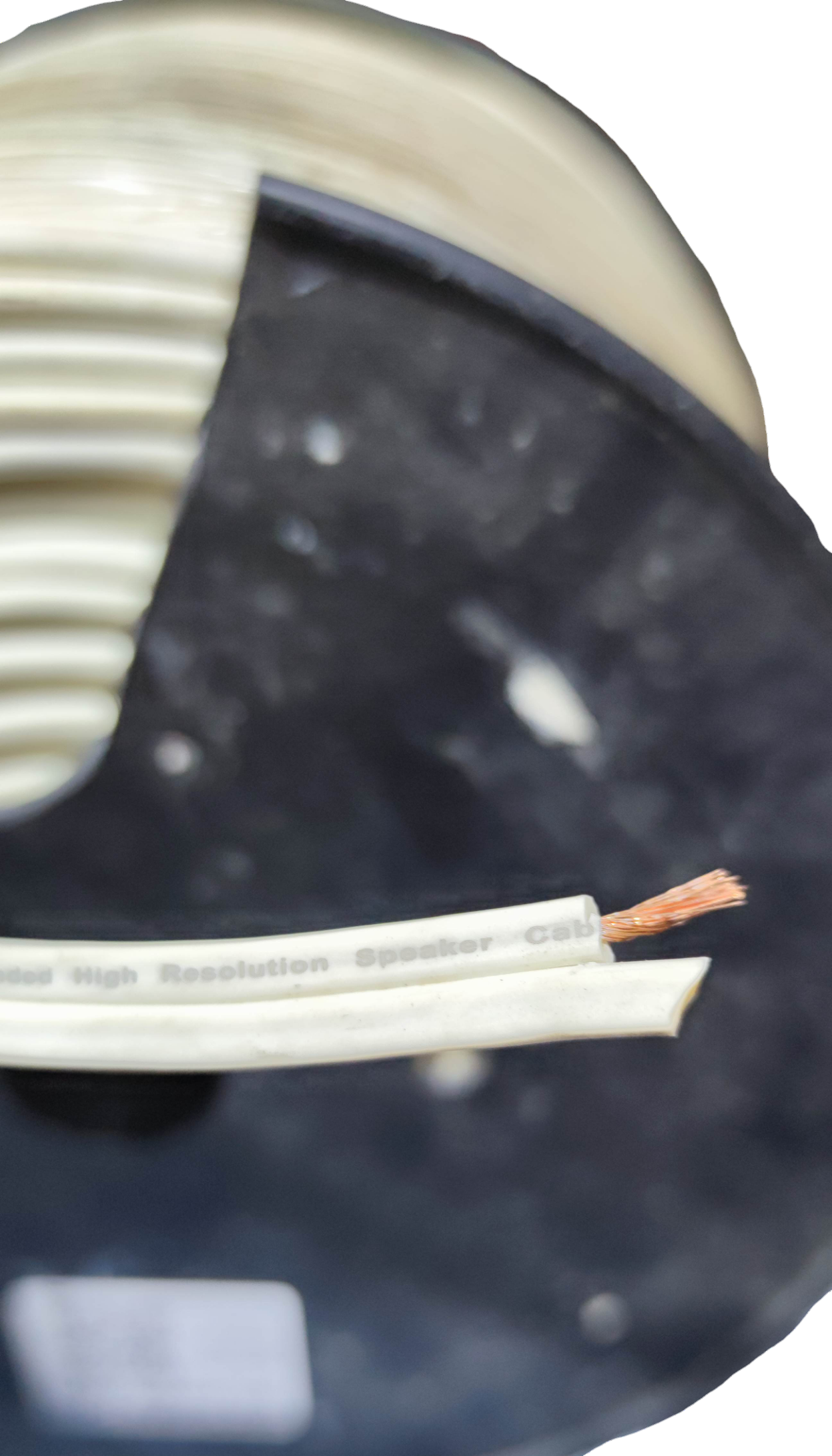 Monster magnetic flux tube speaker cable on a spool with exposed copper wire