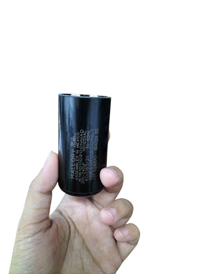 Mallory 200-240UF 110-125V AC start capacitor held in hand for easy reference