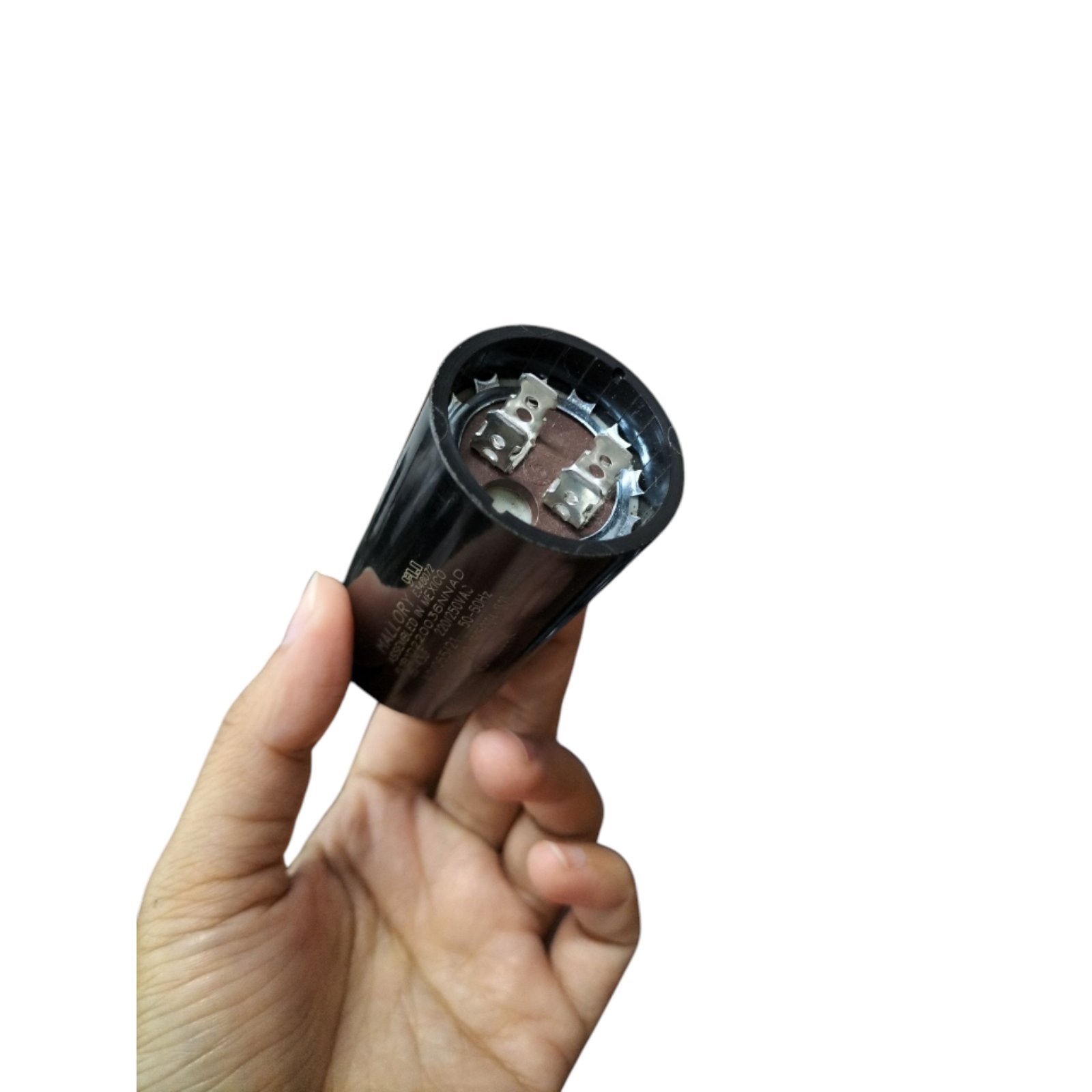 Mallory 36-43UF 220-250VAC motor capacitor held in a hand for electrical circuit applications