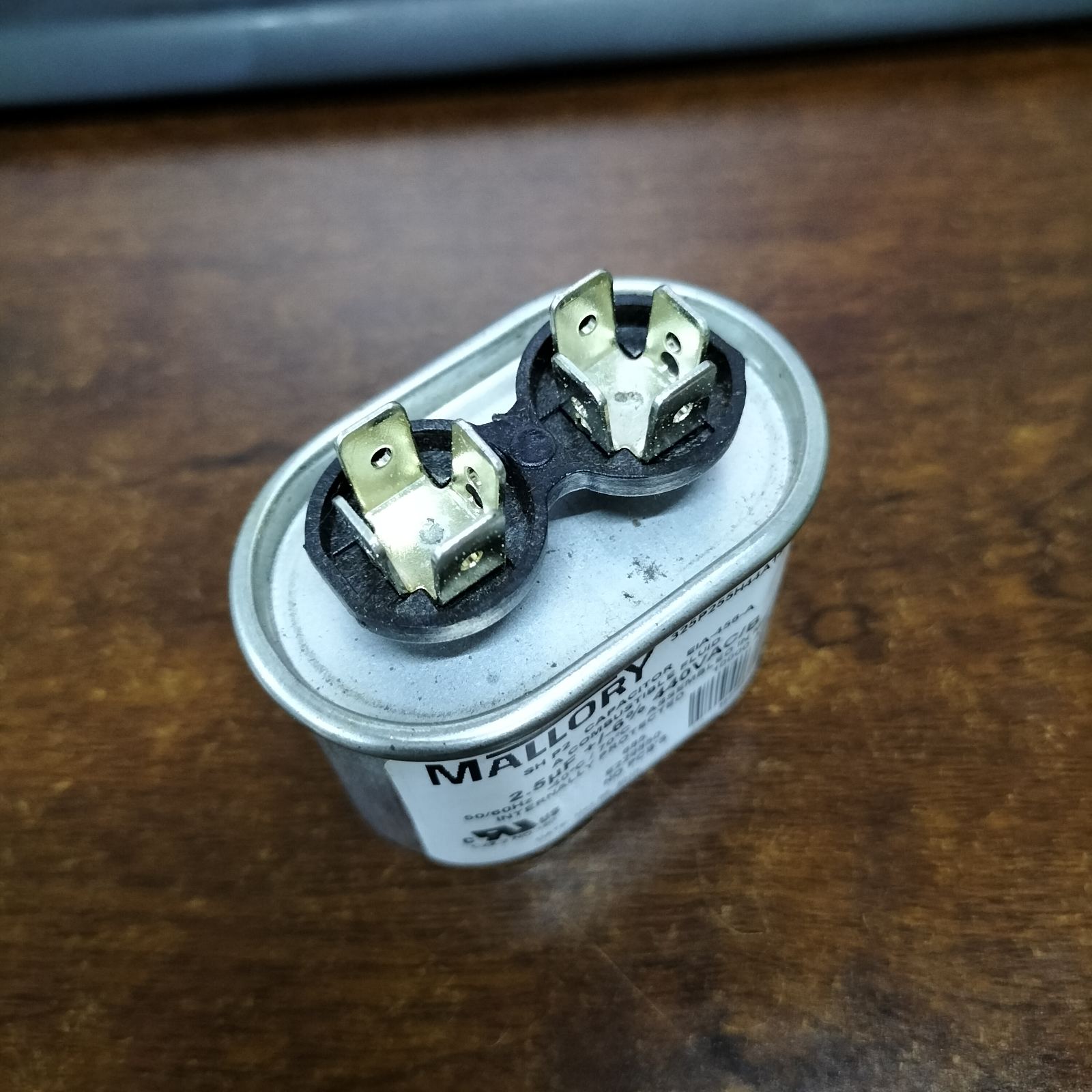 Mallory 440V running capacitor with dual terminals for electrical applications