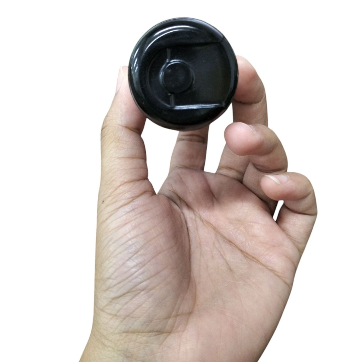 Mallory motor capacitor held between thumb and fingers for electrical circuitry applications