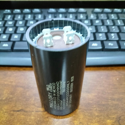 Mallory motor capacitor black cylindrical electrical component with metal terminals