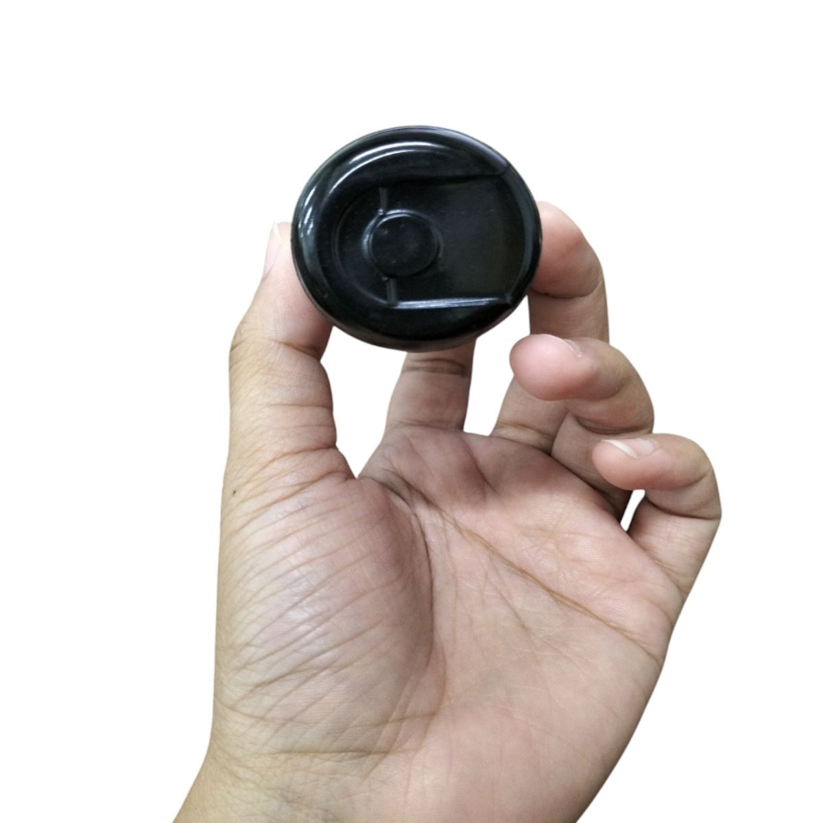 Mallory Motor Capacitor in a person's hand showcasing its compact design for electrical applications