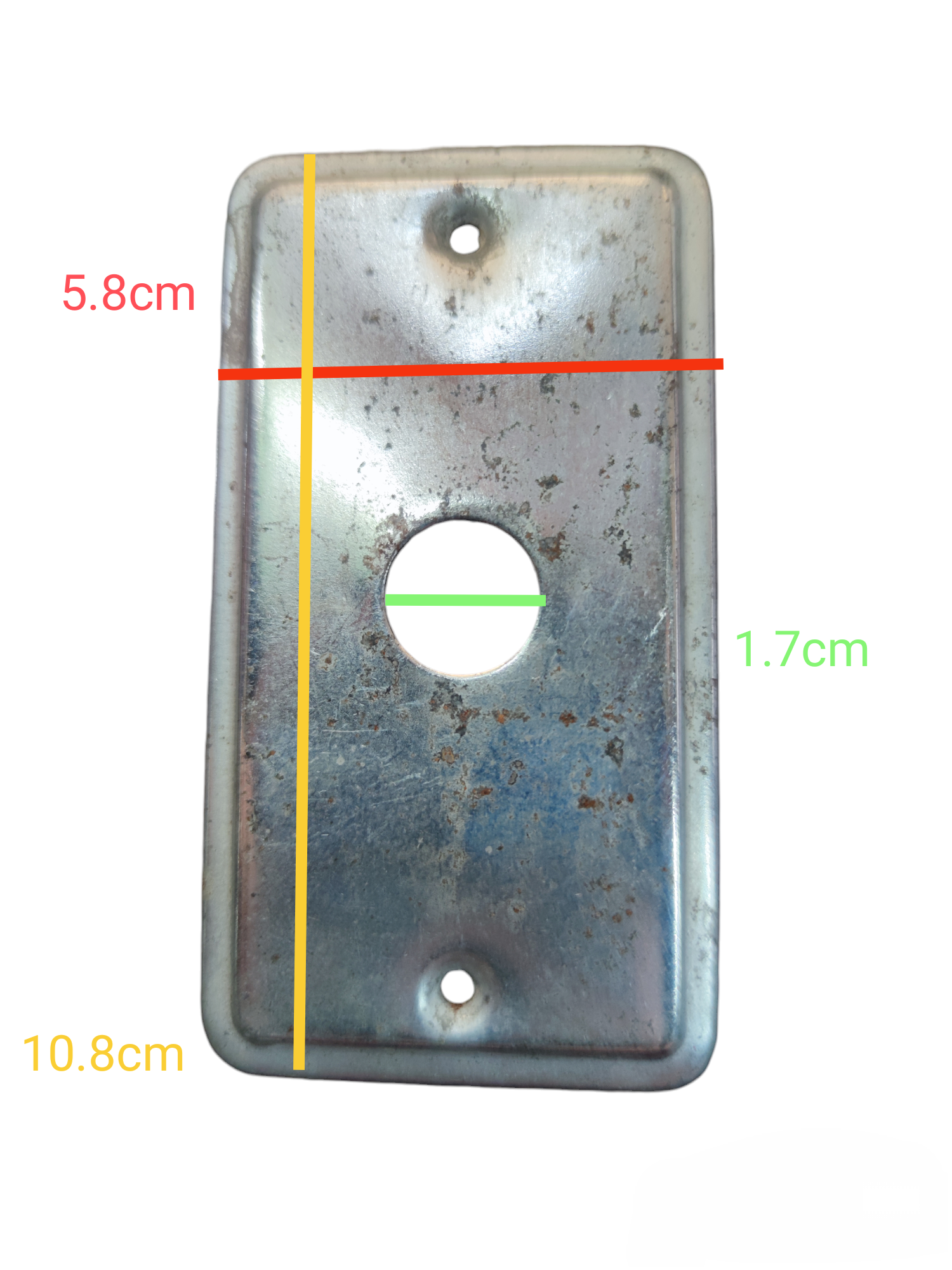 Metal plate cover with a 1.7cm hole, measuring 5.8cm by 10.8cm for electrical applications