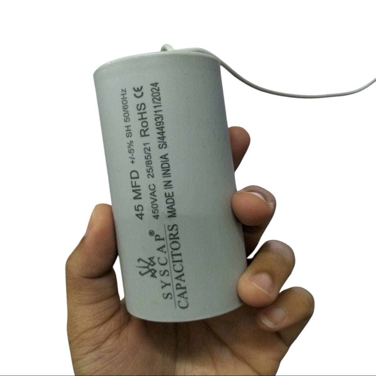Syscap Motor Capacitor 45 MFD 450V in Hand for Electrical Applications