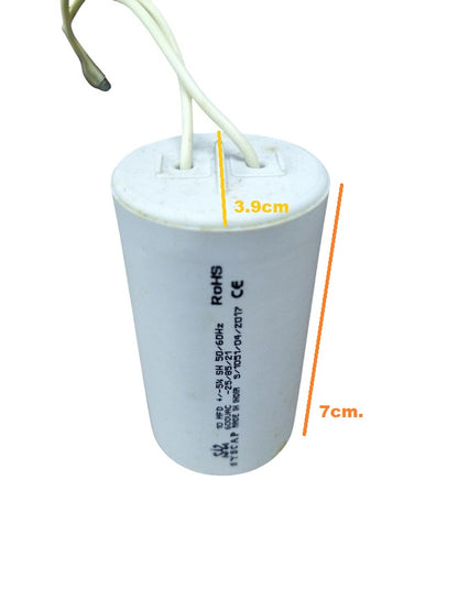 Syscap motor capacitor with white cylindrical body and two attached wires for electrical circuitry