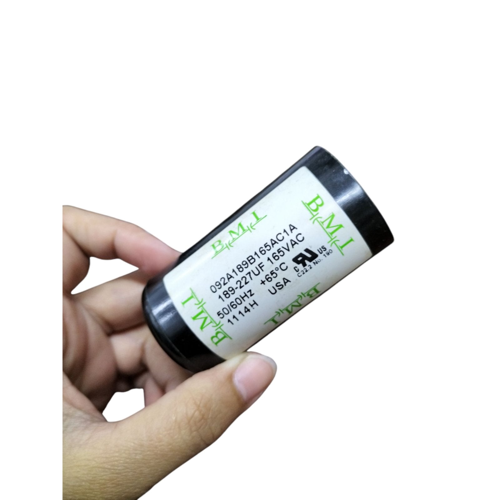 BMI Motor Start Capacitor 189-227uF in a hand, ideal for electrical circuit applications