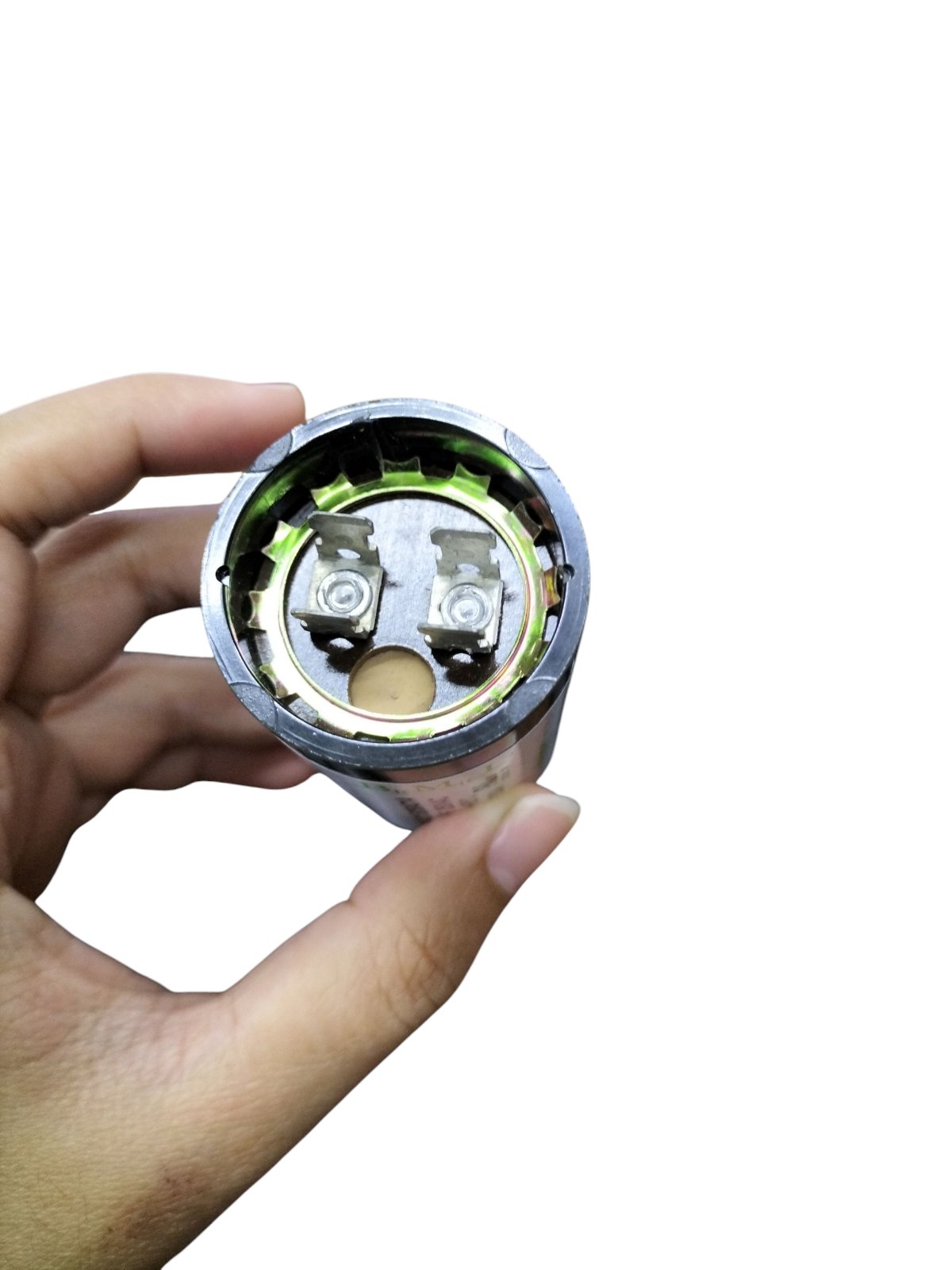 Motor Starting Capacitor 21-25uf 250v with internal connections shown held in a hand