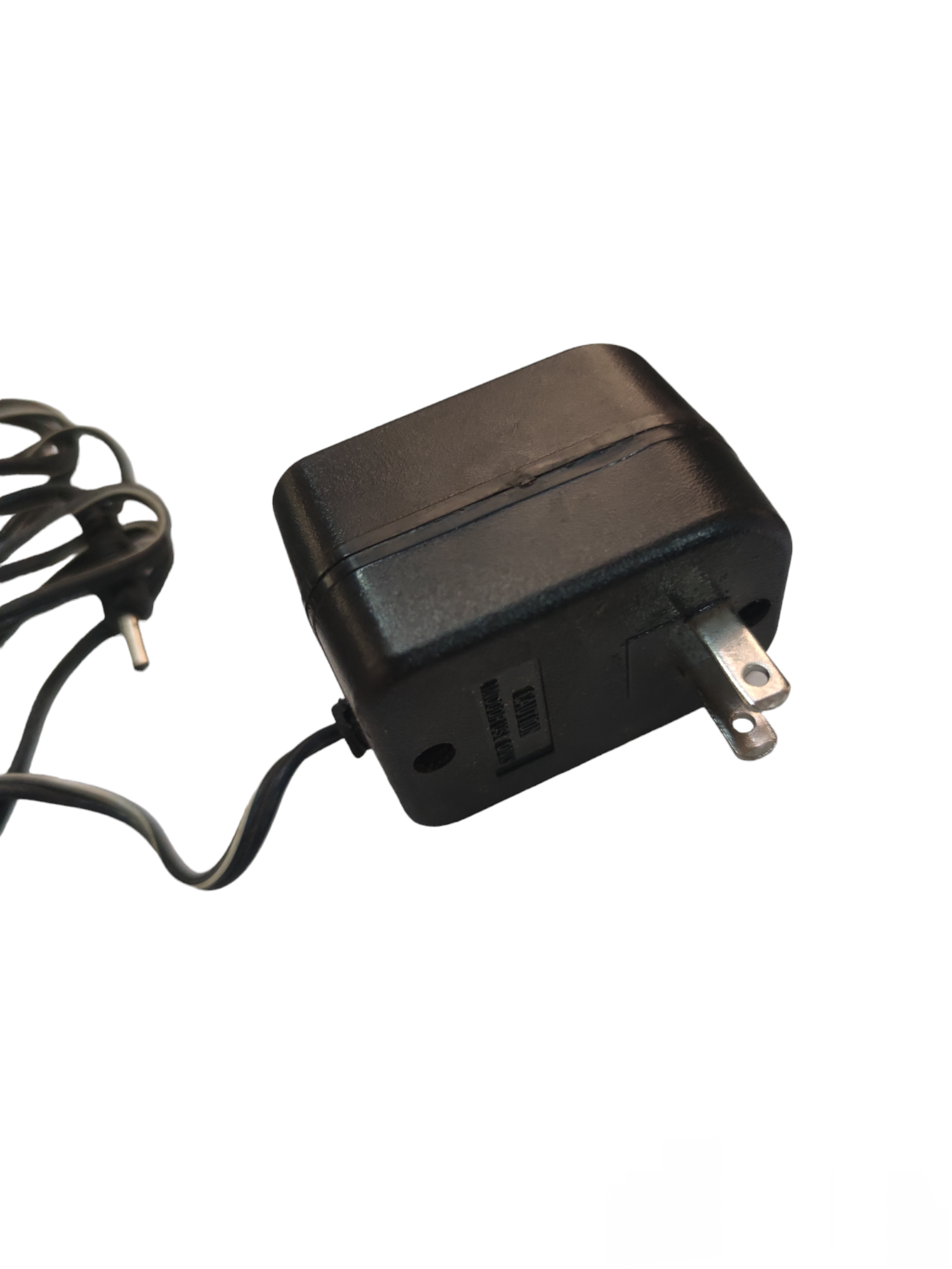Local brand multi output AC adaptor with black compact design and attached power cord