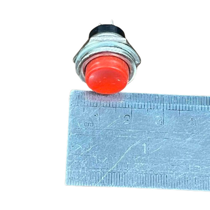 Normally Open Switch 1A Red 220V Push Button with a compact design next to a ruler