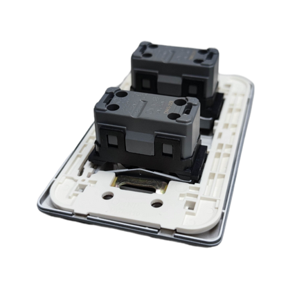 Omni 2 gang 3 way switch showing back side with wiring and mounting components