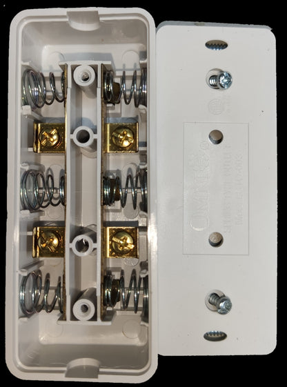 Omni 3 gang extension outlet with white casing showing internal springs and brass connectors