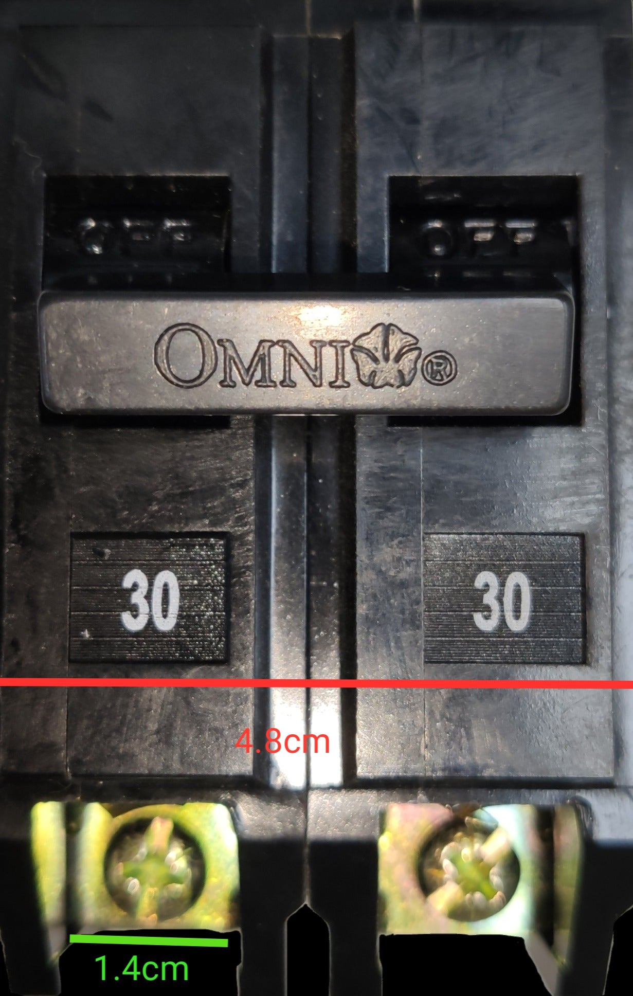 Omni 30A Circuit Breaker Plug-in Type electrical part with black casing and metal screws close-up