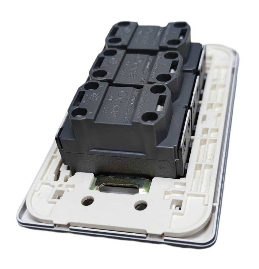 Rear view of Omni 3 gang universal outlet showing white faceplate metal mounting bracket and three black modules