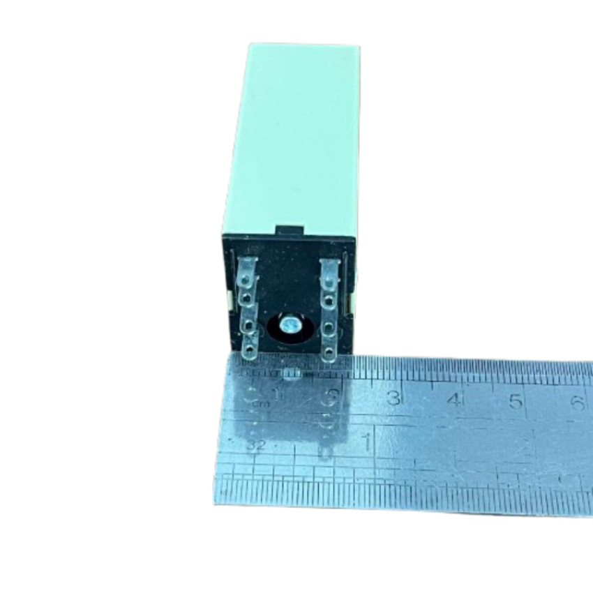OMRON Timer Relay 30 seconds 8 pins 110V showing black pin base and ruler for size reference