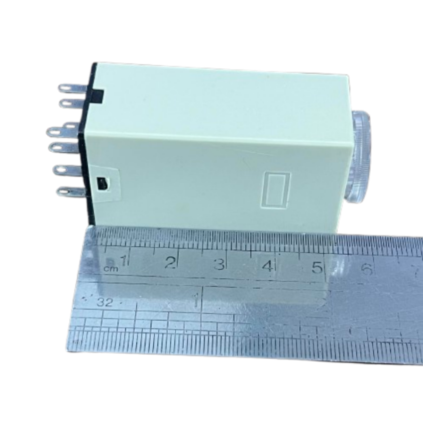 OMRON Timer Relay 30 seconds 8 pins 110V compact beige rectangular housing with adjustment dial and visible pins next to ruler